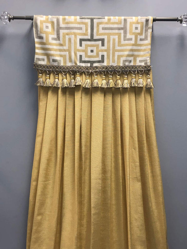 gold curtain and pillow with patterns